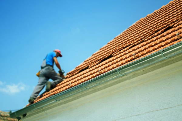 4 Ways Repairing Or Replacing Your Roof Benefits Your Home